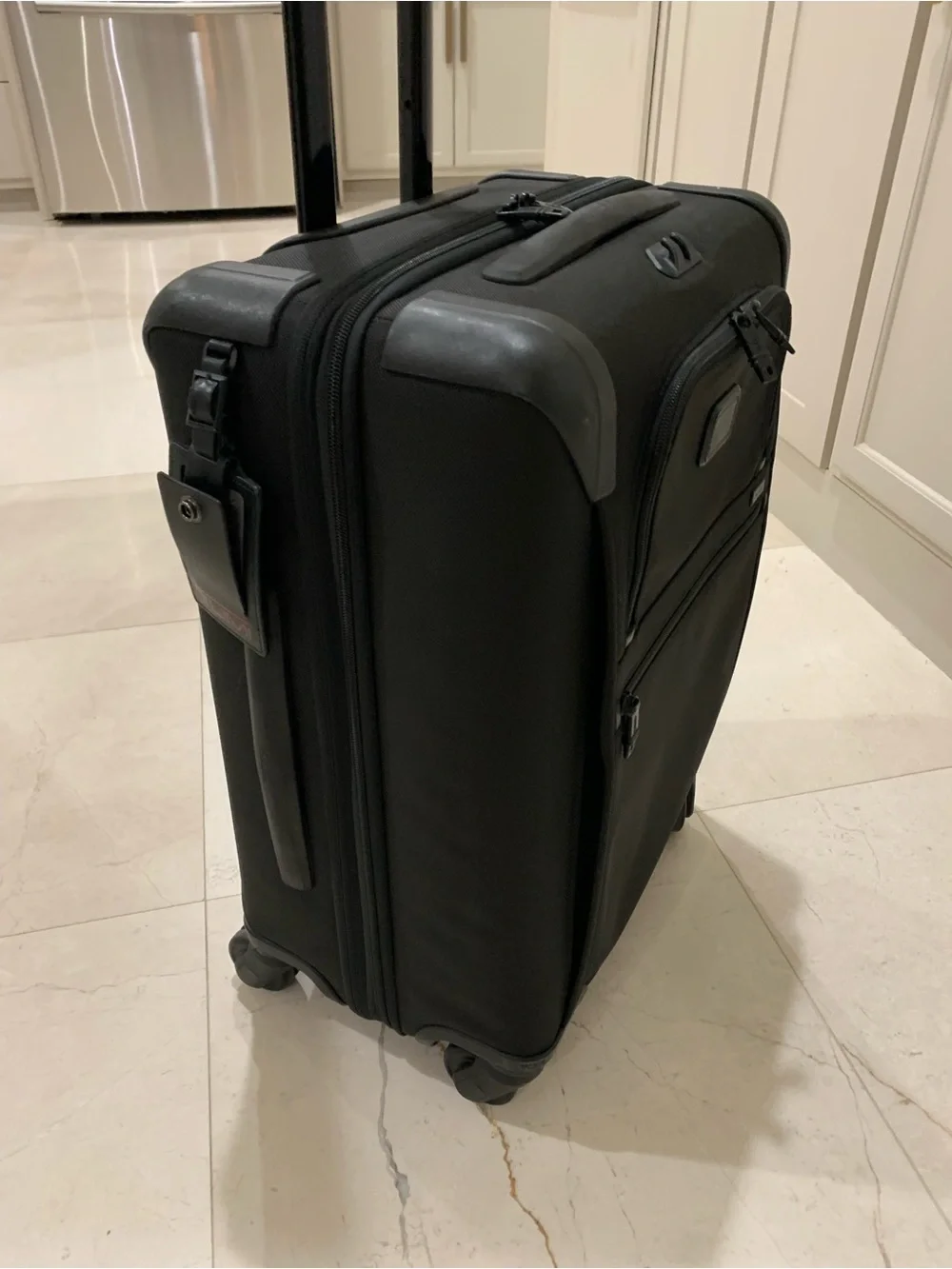 Tumi Black Spinner Carry-On with Front Zip Pocket luggage